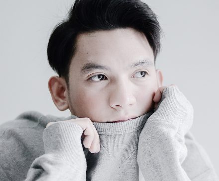 Man wearing gray long-sleeved top